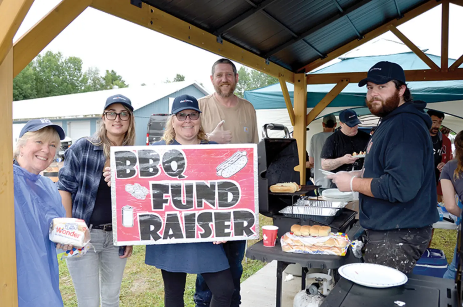 Dexterra employees showing up with heart at a community BBQ fundraiser.