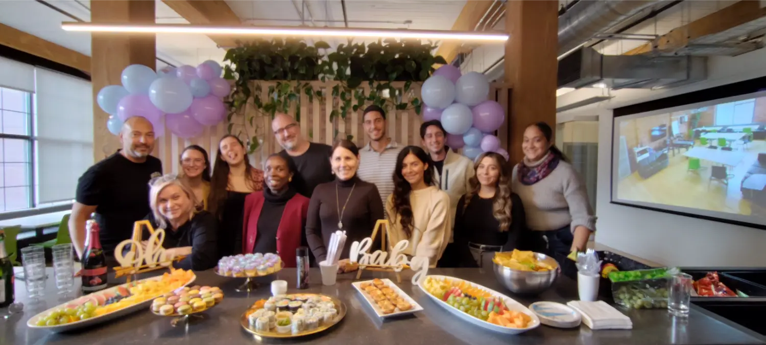 Celebrating a team member’s upcoming baby with a baby shower.
