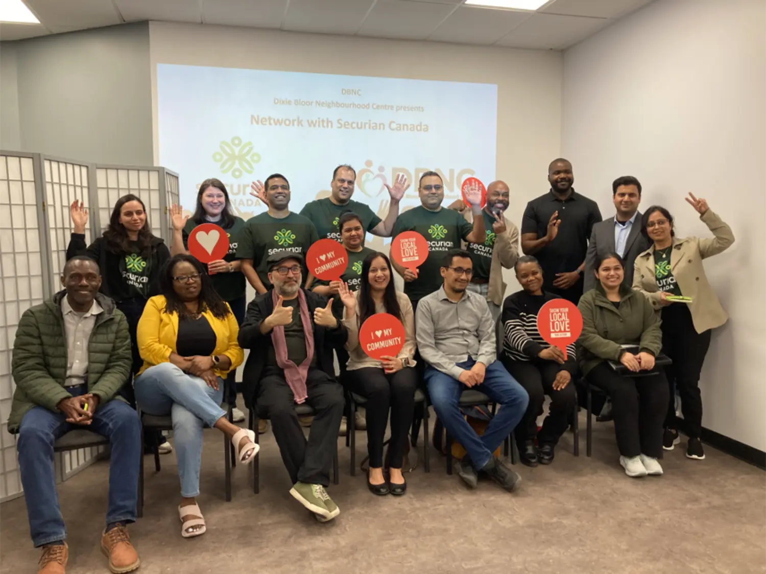 Securian Canada employee volunteers connect with job seekers to offer career insights during a networking event.