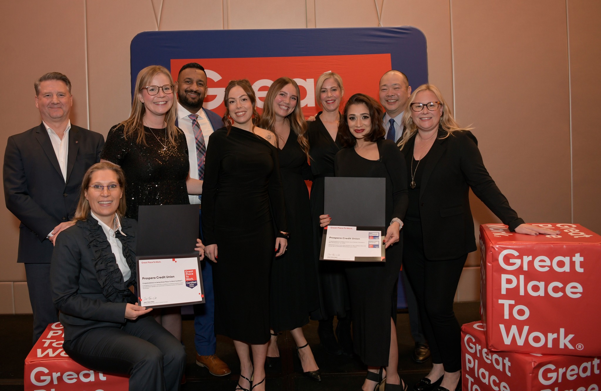 Team holding recognition at Best Workplaces event