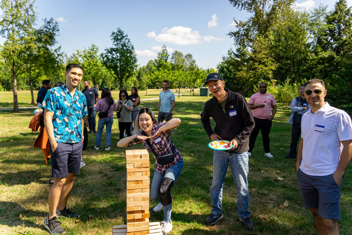 Giant Jenga at our annual summer picnic. A fun moment of friendly competition!