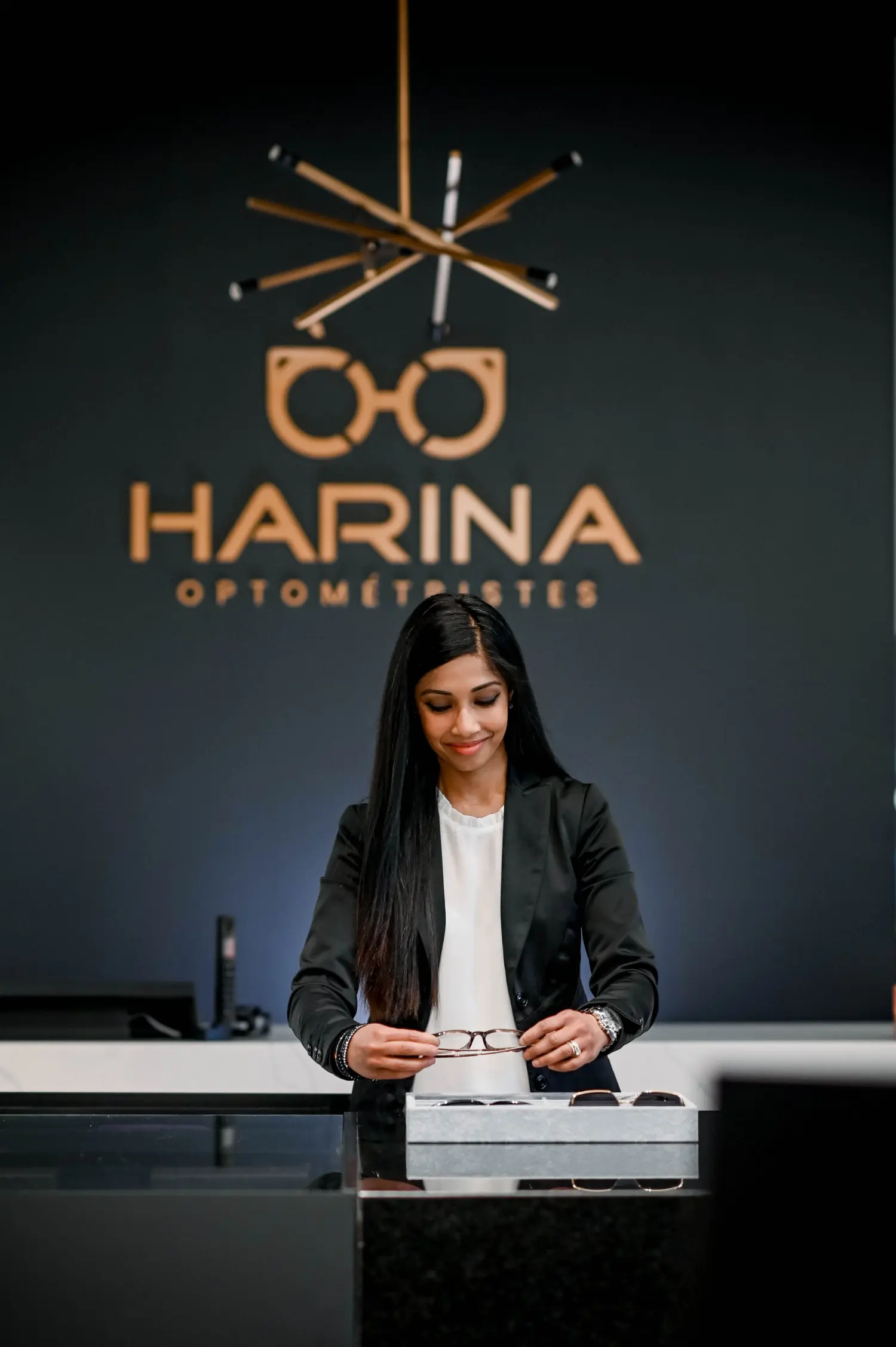Dr. Harina looking at the glasses selection