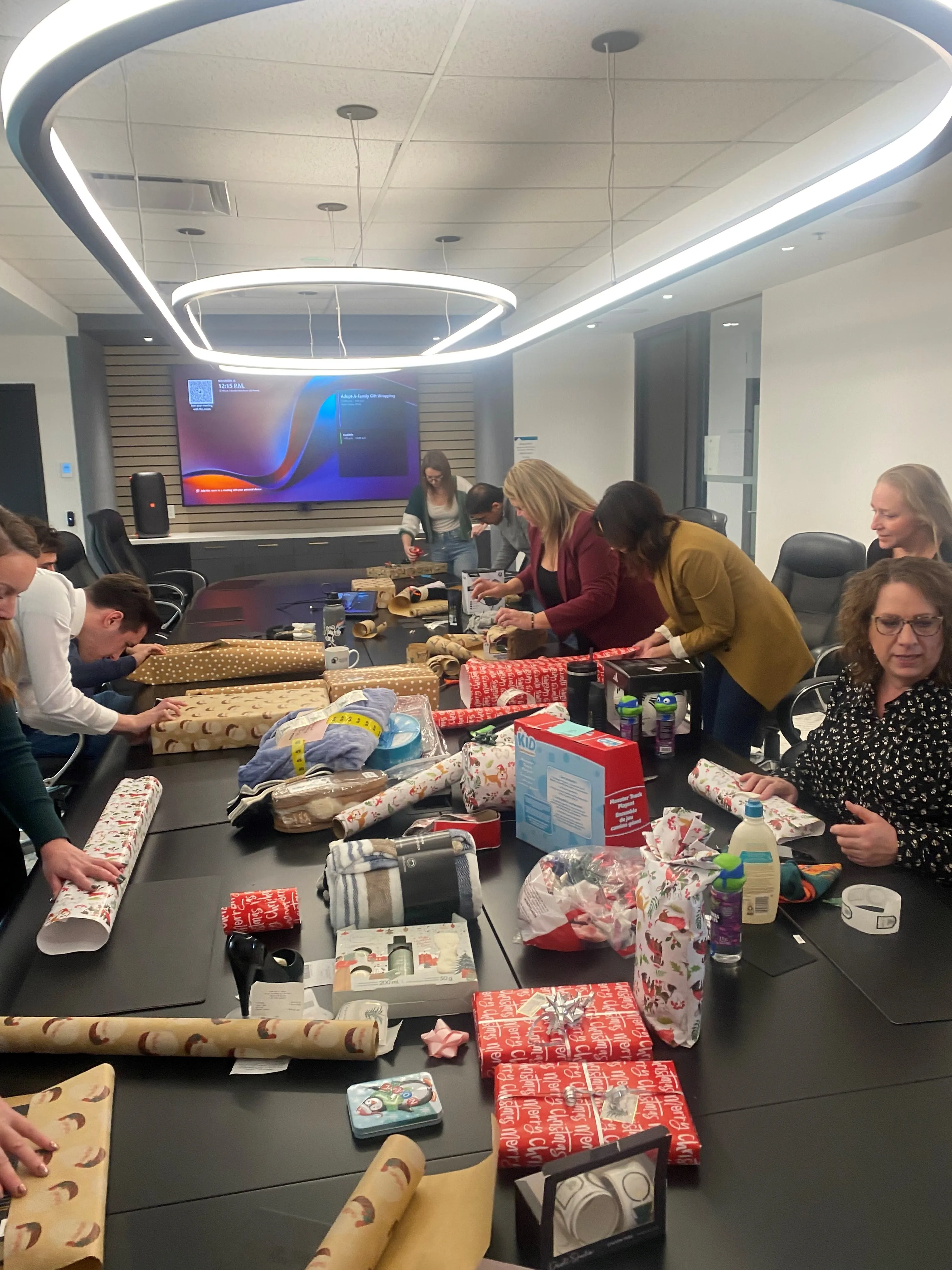 Wrapping gifts for our Adopt-a-Family.  We brighten the holidays for a family of 7.