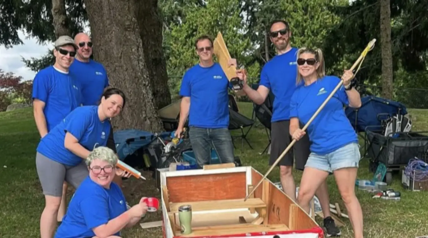 Employees participate in the Silly Boat race in support of a local Child Development Centre