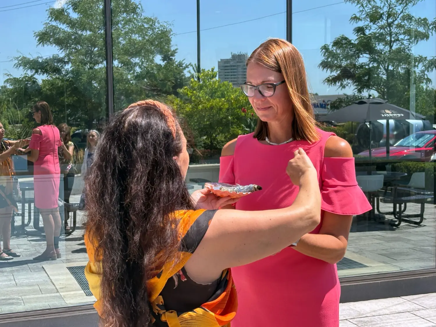 Christine Donaldson (CEO) takes part in a smudging ceremony led by Indigenous artist and entrepreneur Tamara Goddard.