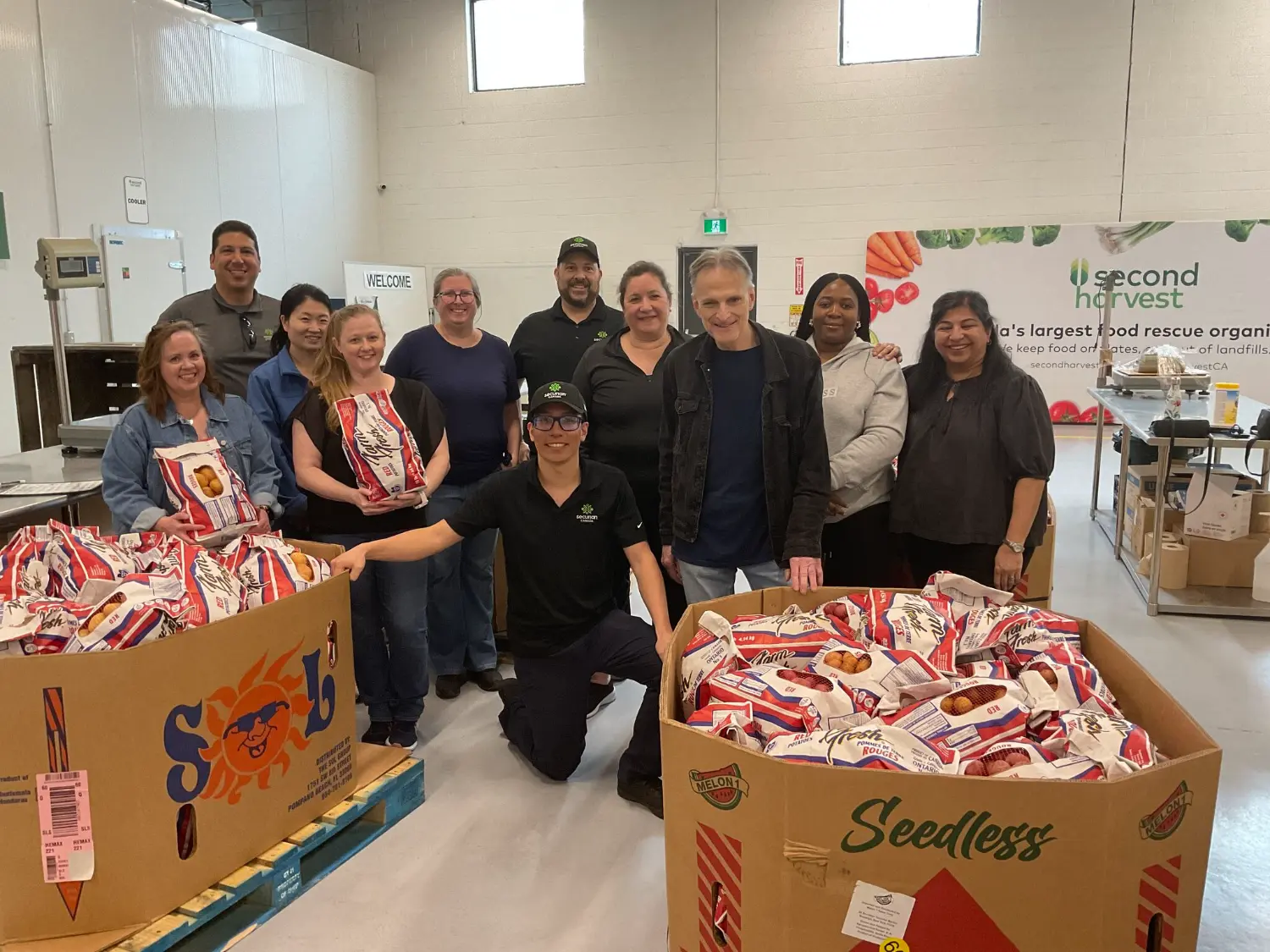 Volunteers at Second Harvest, sorting thousands of pounds of food to fight hunger and waste.