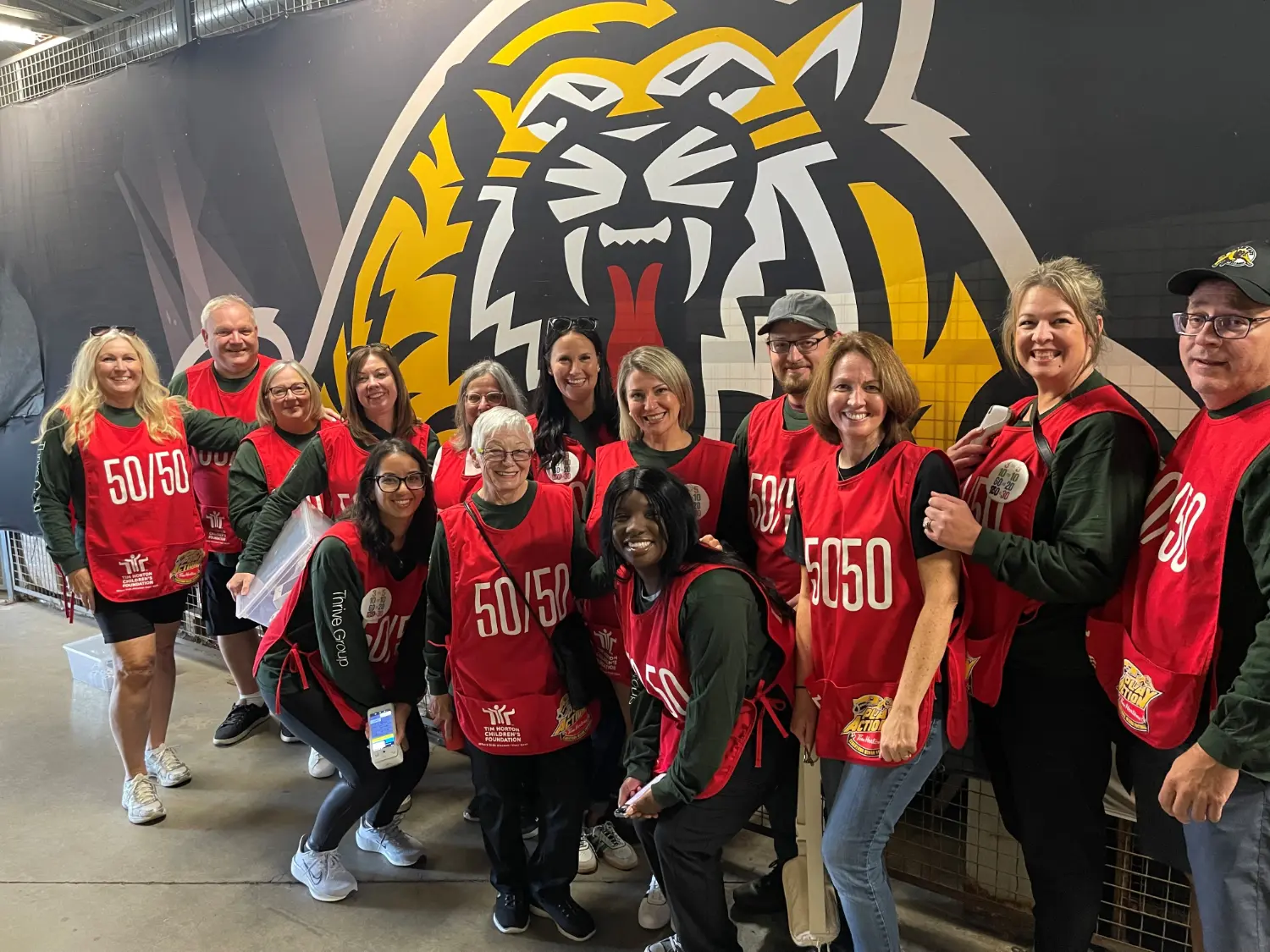 Thrive Group leaders volunteering to sell 50/50 tickets at Hamilton T-Cat games in support of our programs.