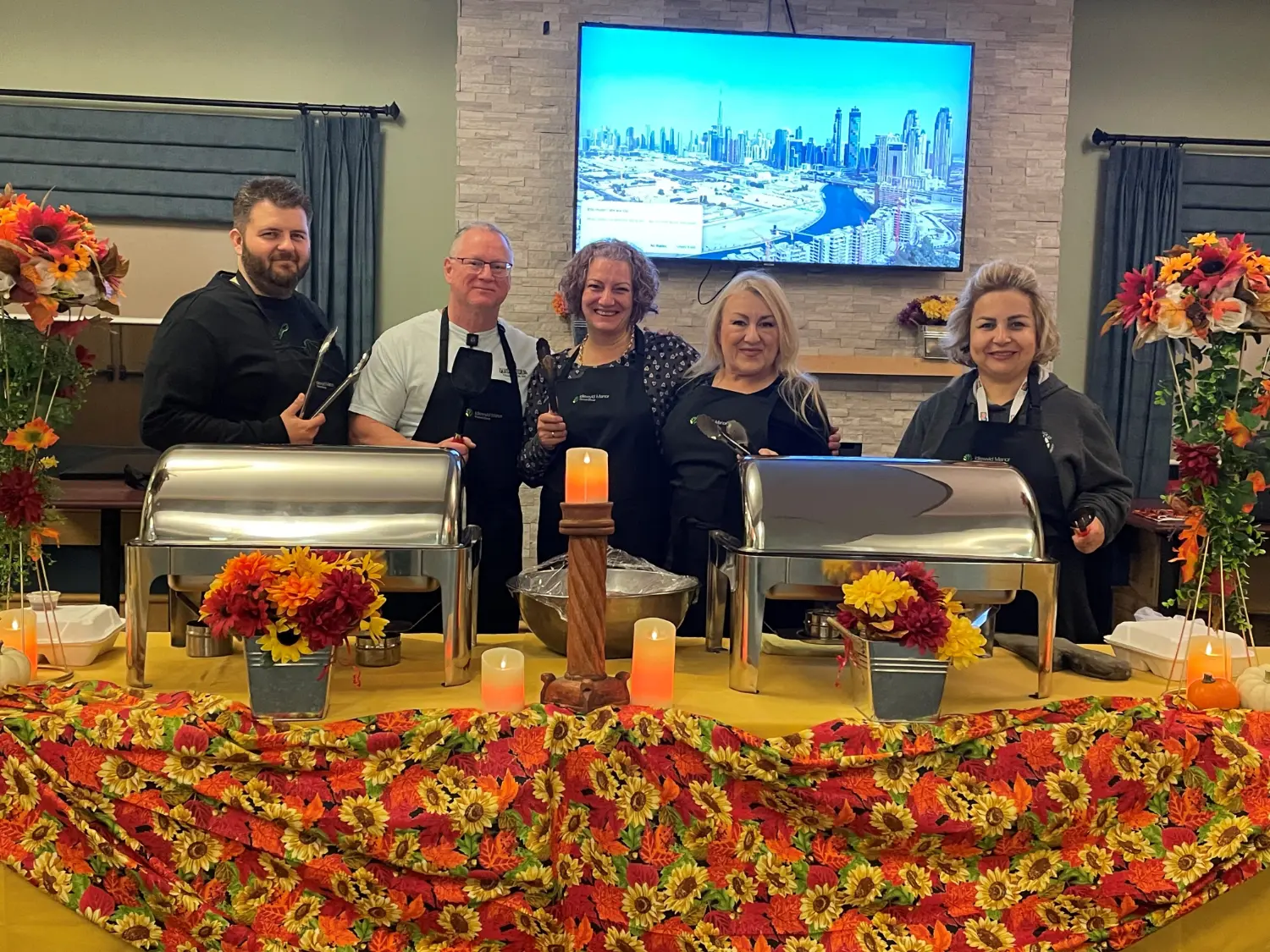 Idlewyld Manor leaders serving food to staff on Staff Appreciation Week!