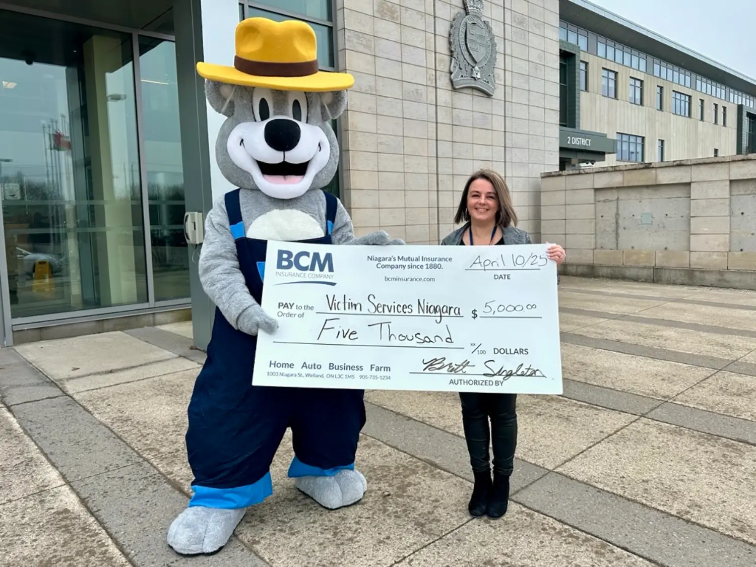 Bertie the Bear presents BCM Insurances Community Grant Program Cheque for $5,000 to Victim Services Niagara.