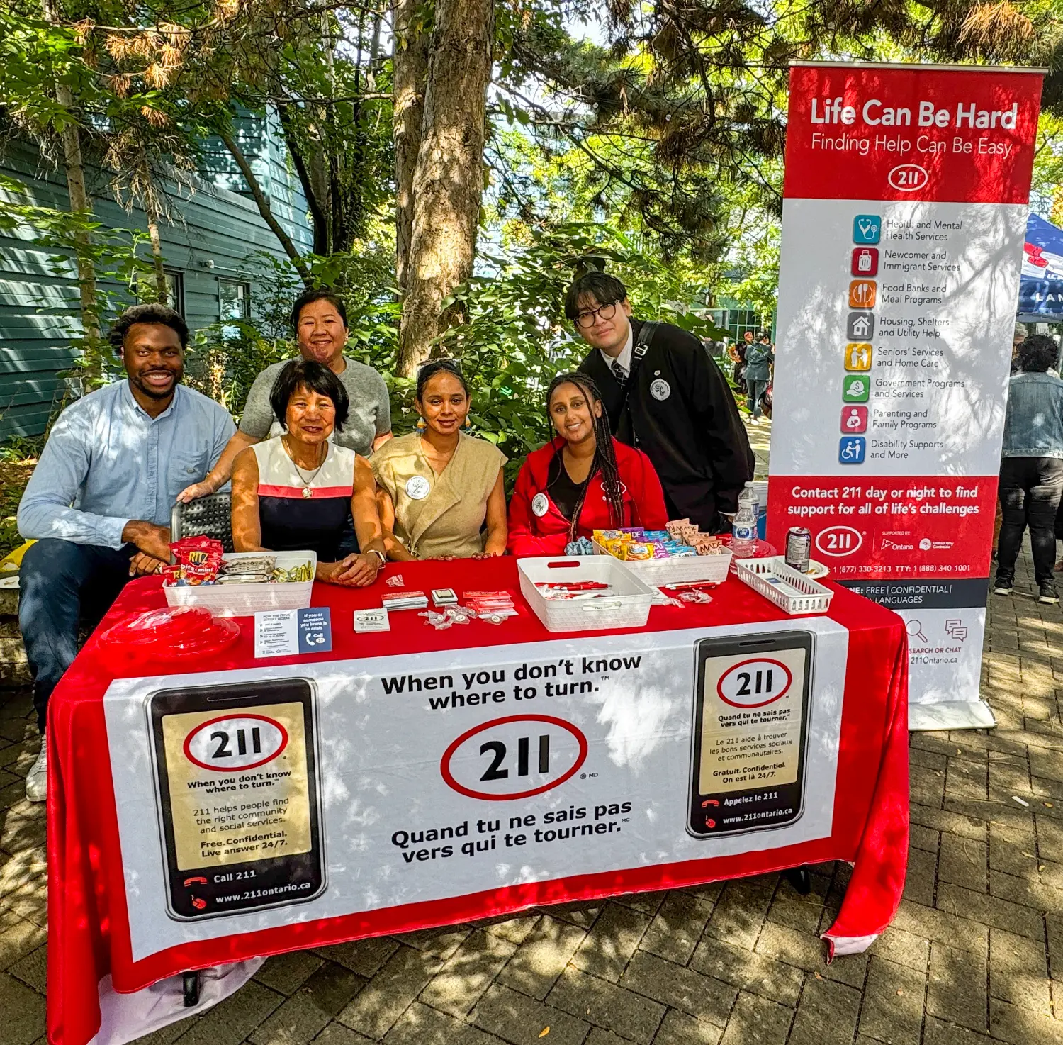 Team members engage with community partners in community outreach