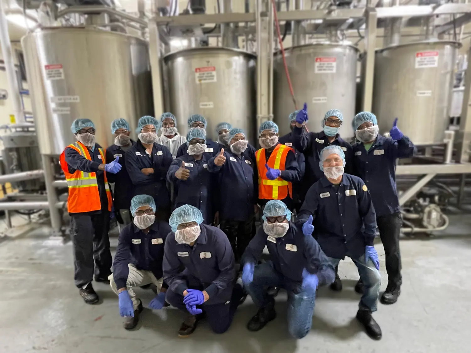 Processing & Material Handling Team Members in front of our Tanks & Kettles in the Processing department.
