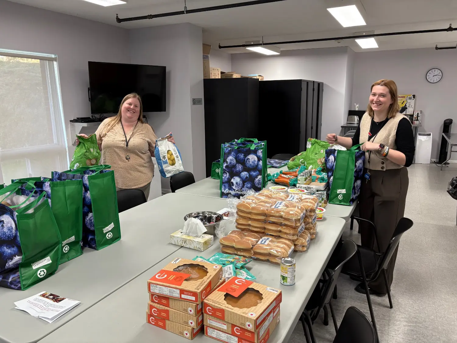 Employees prepare for PHARAs 8th Annual Turkey Dinner Giveaway.