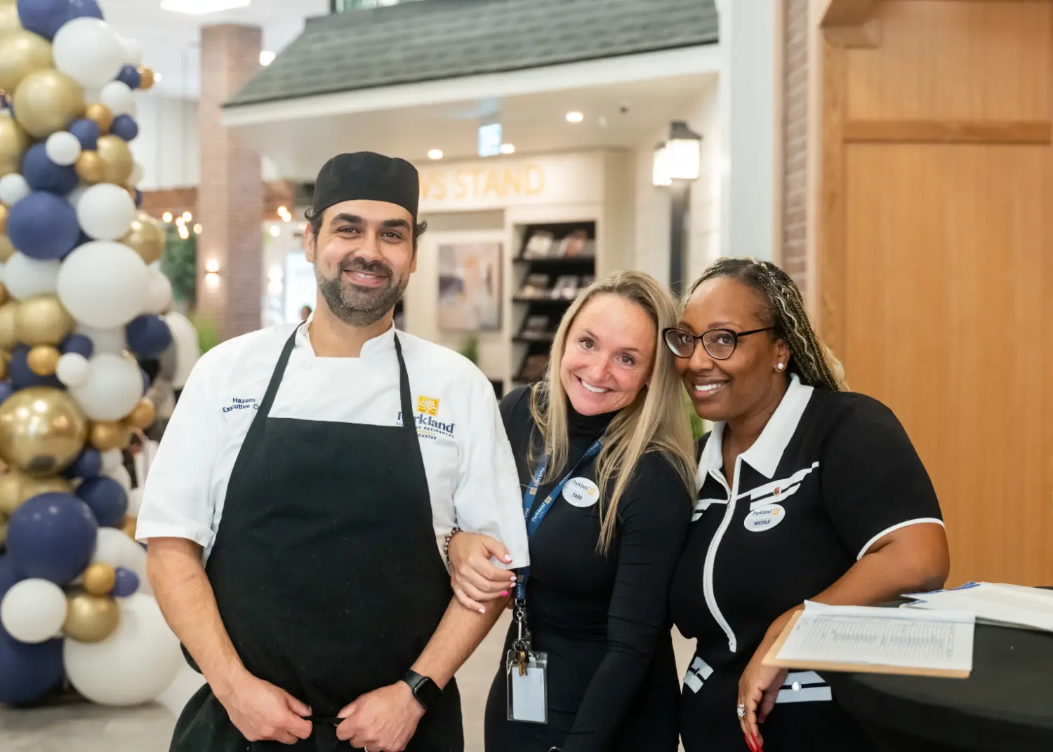 Enthusiastic team members pose at the Grand Opening of our new retirement living community in Ancaster, Ontario