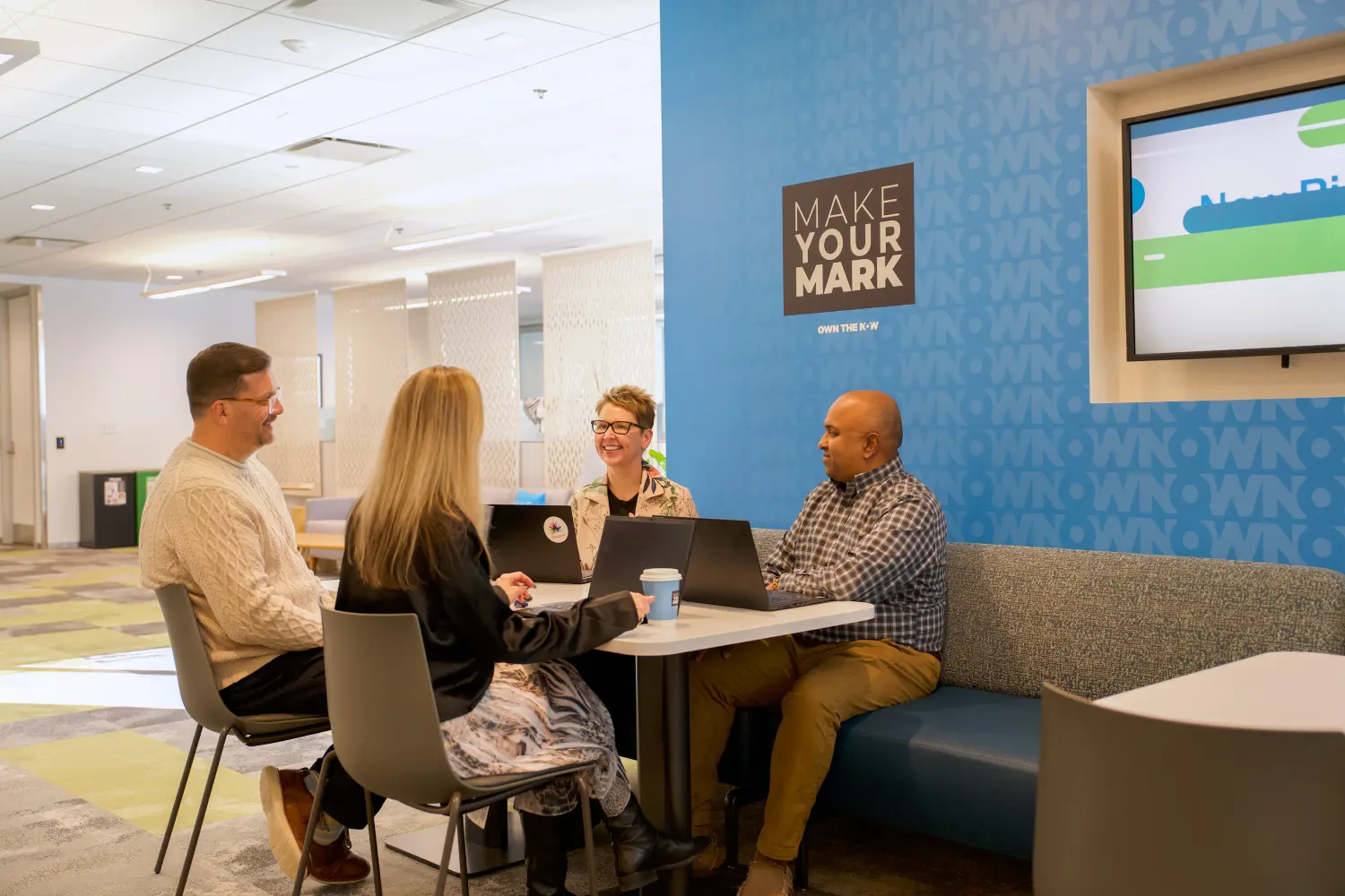 Employees having a casual team meeting.