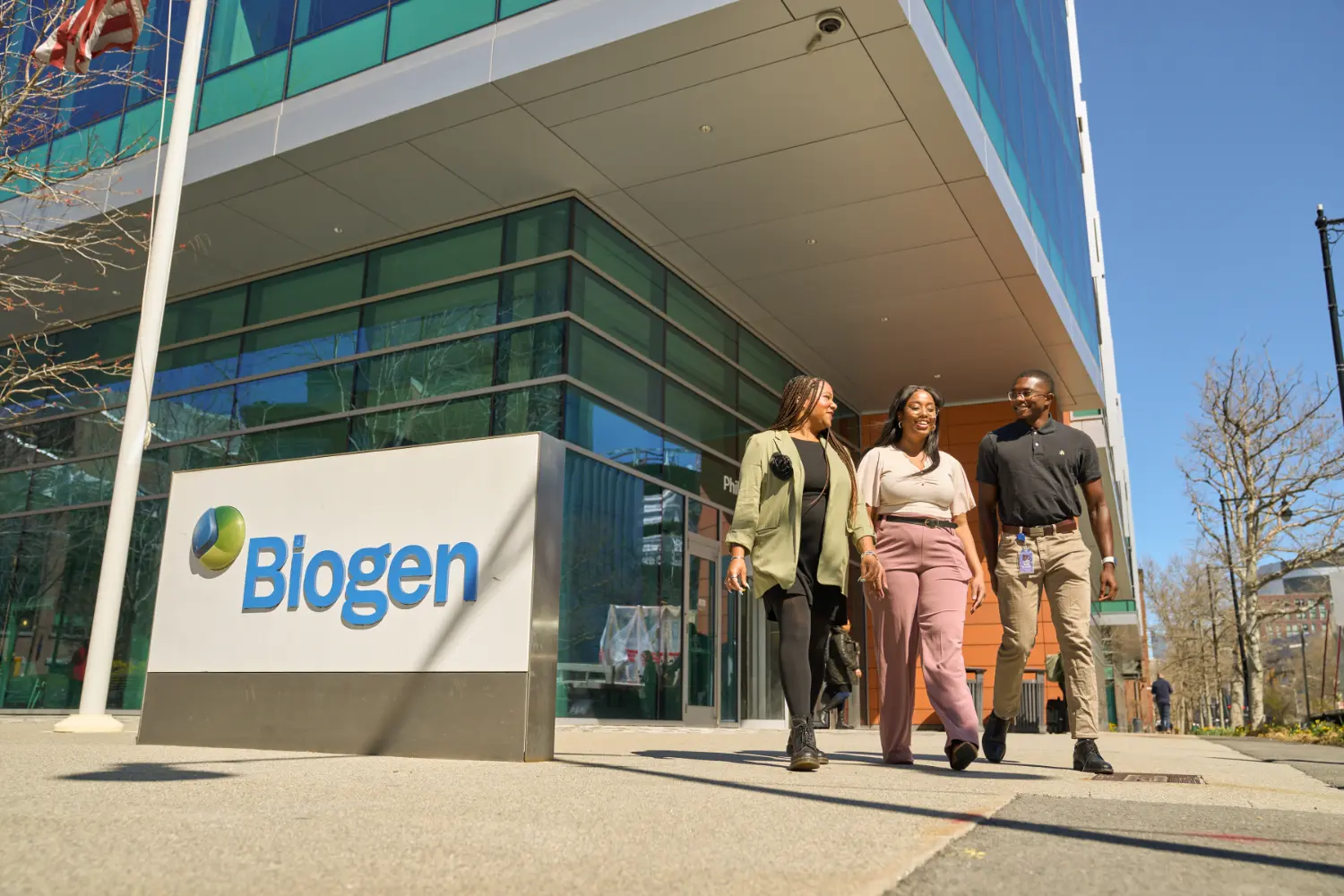 Employees leaving the Biogen headquarters.