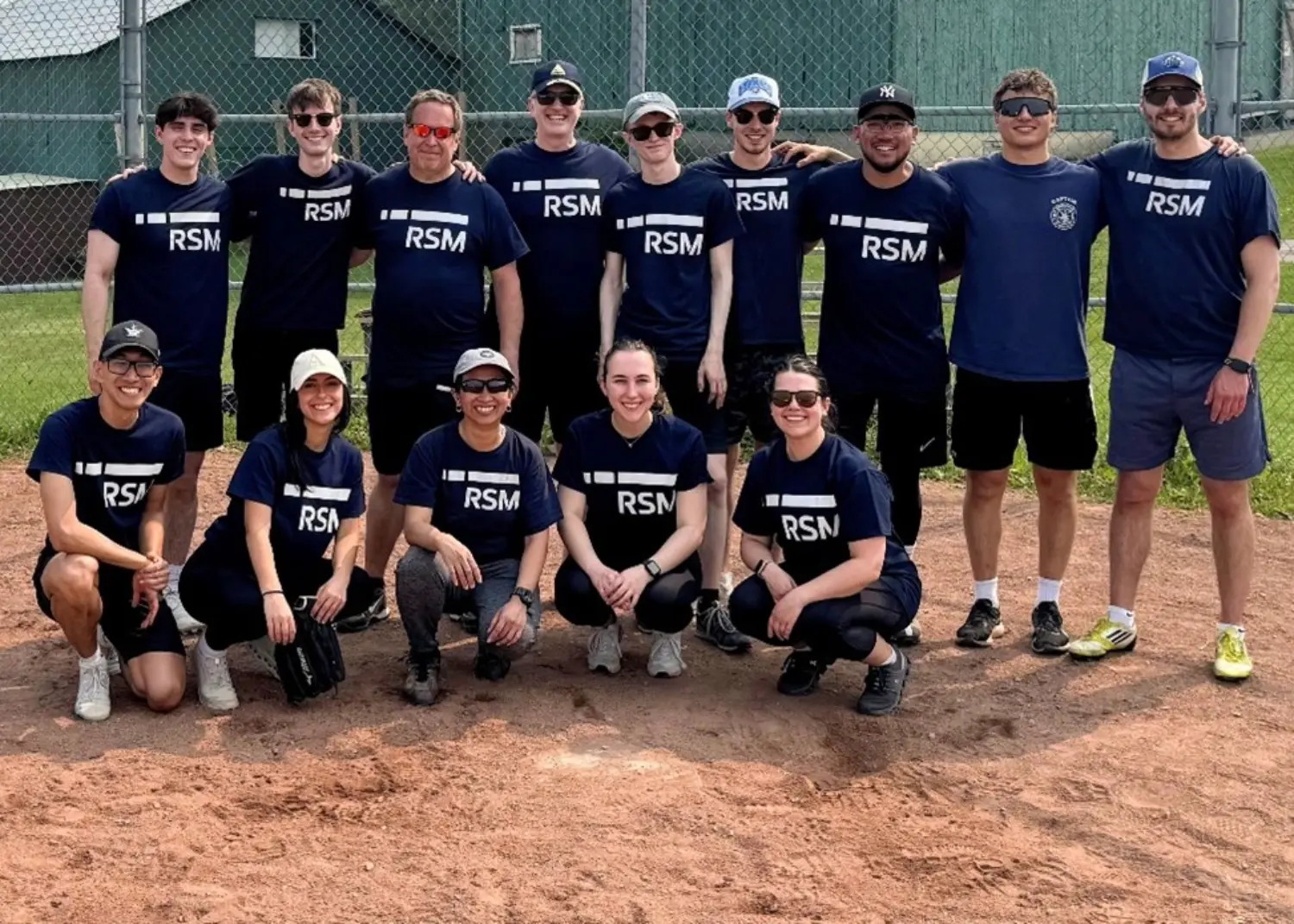 RSM Canada employees participating in a charity baseball game.