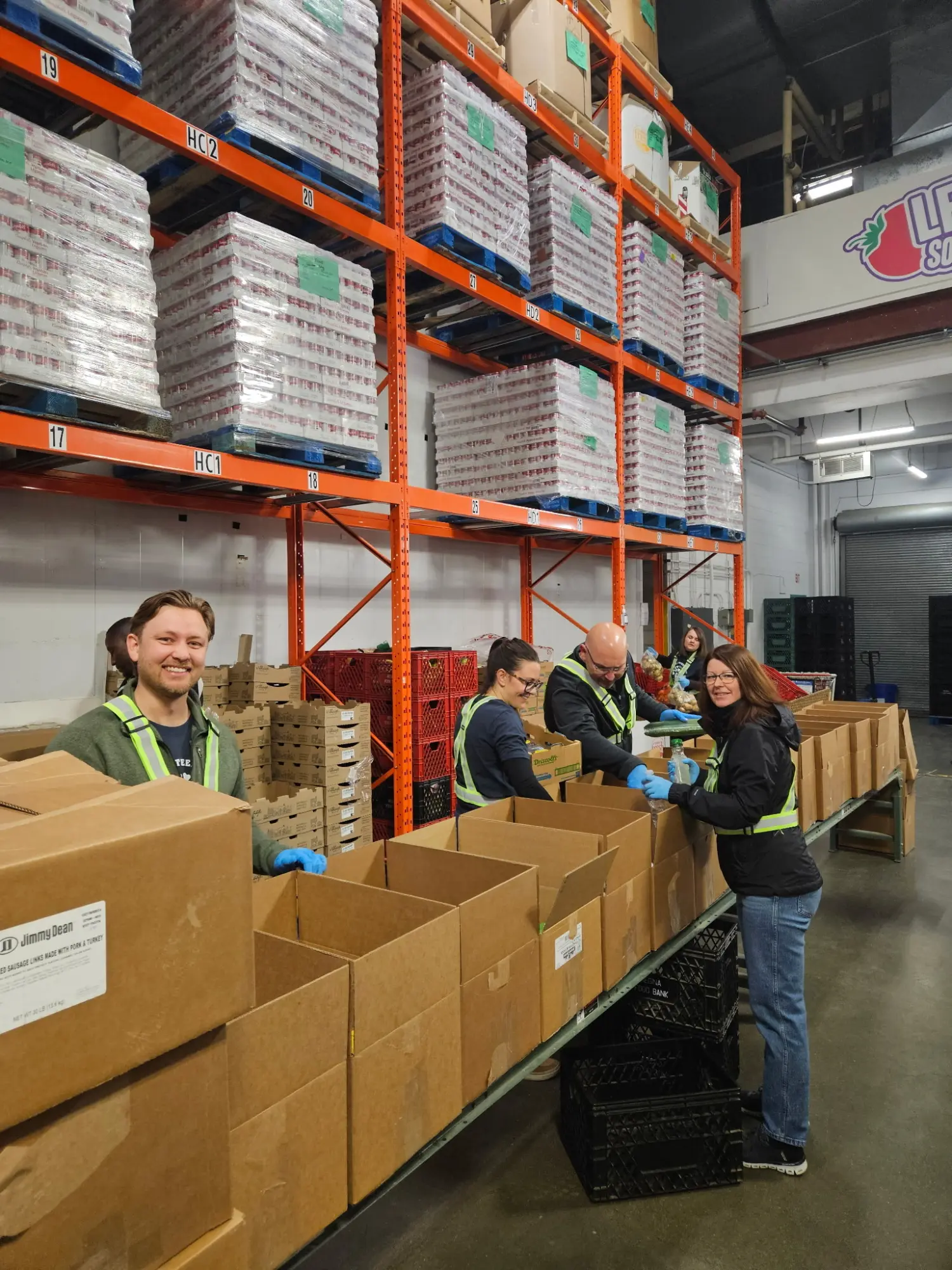 Our team in action at Regina Food Bank—giving time, energy, and heart to support our community.