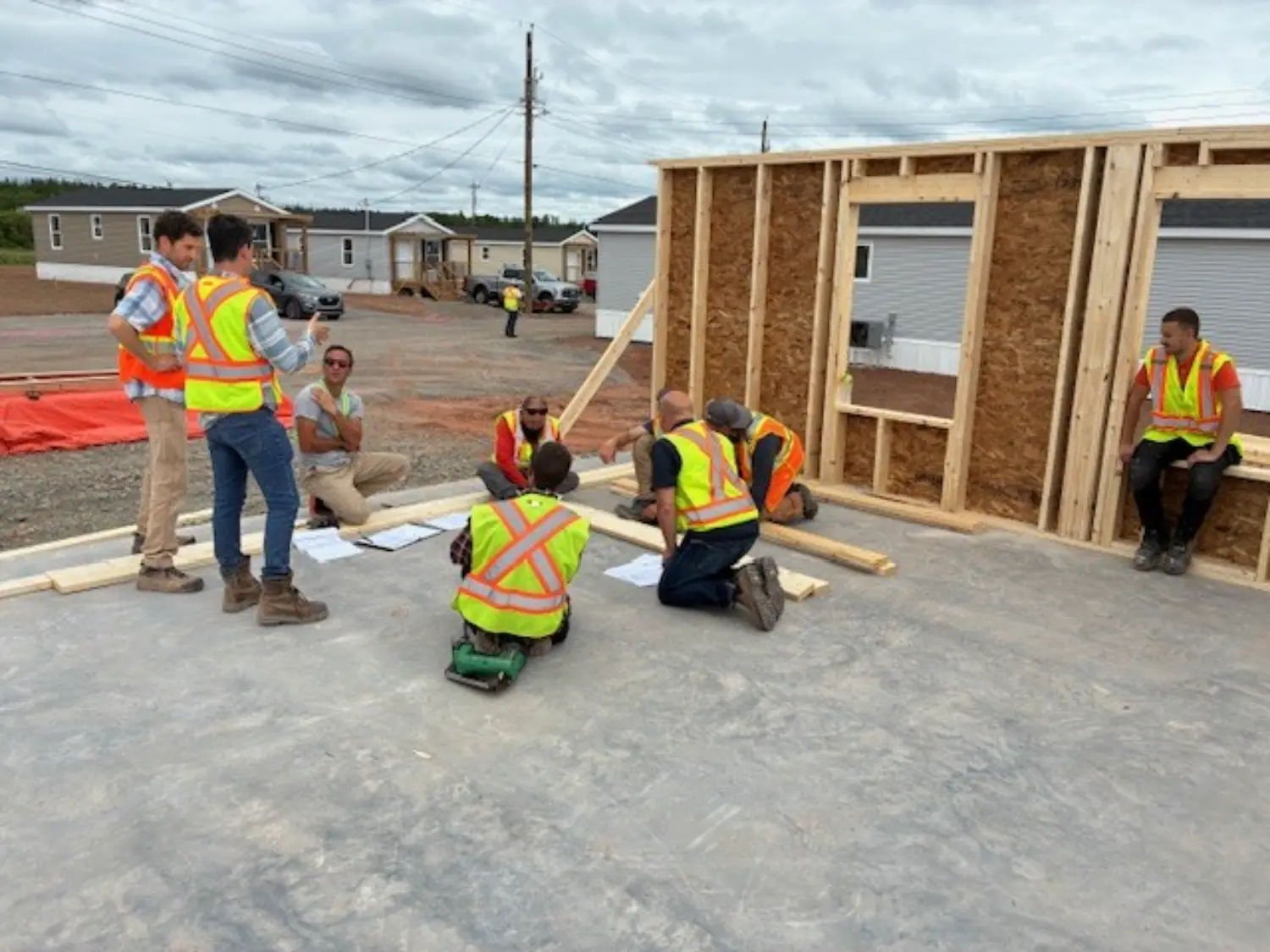 Shaw employees collaborating during the construction of a new home