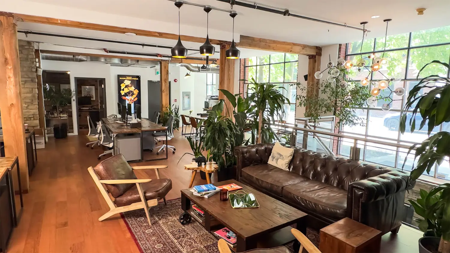 Our open-concept home base—filled with sunlight, plants, and space for bold ideas to grow.