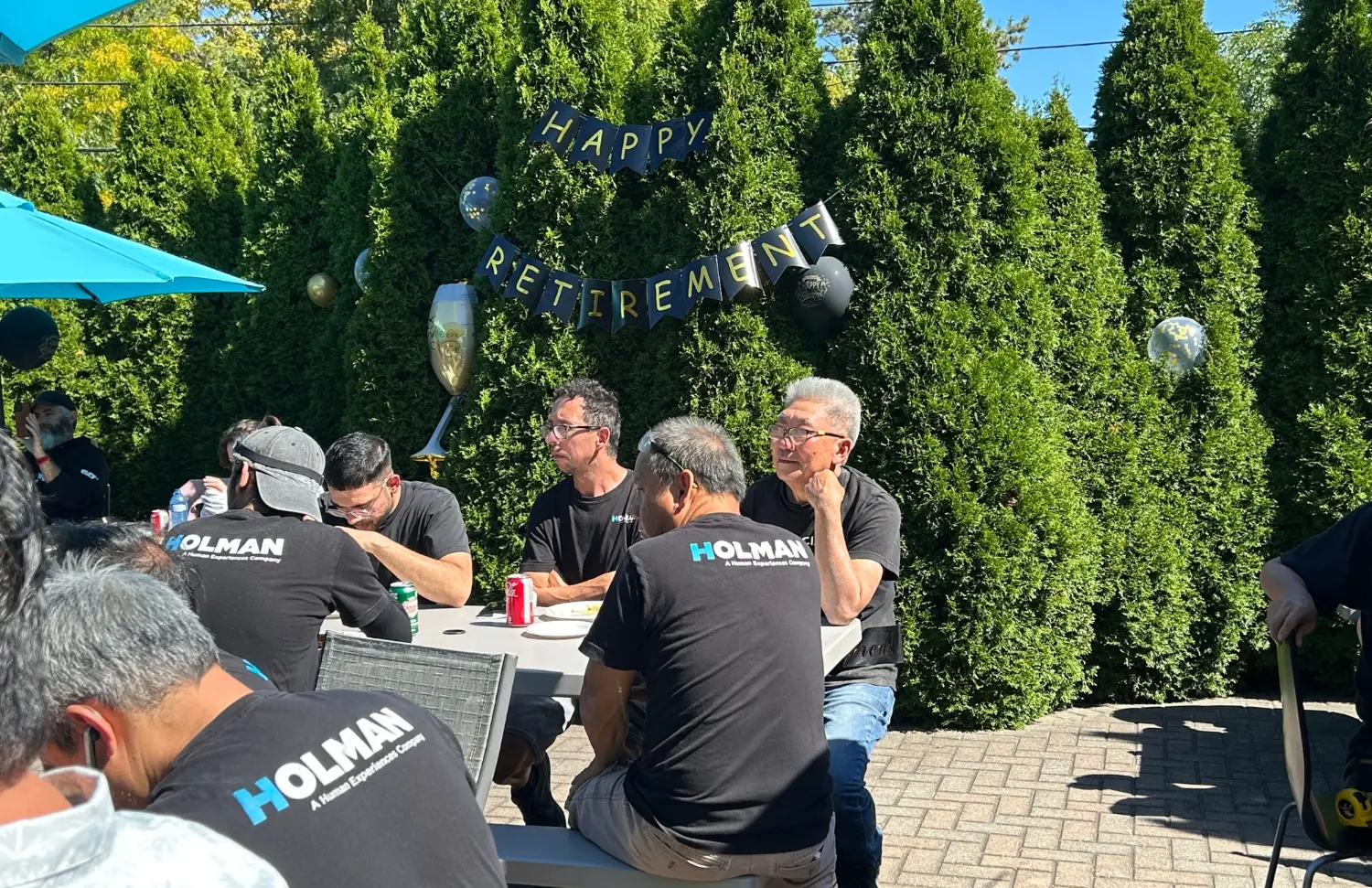 A late summer day on the Holman patio, celebrating a valued team member’s retirement and our culture of connection.