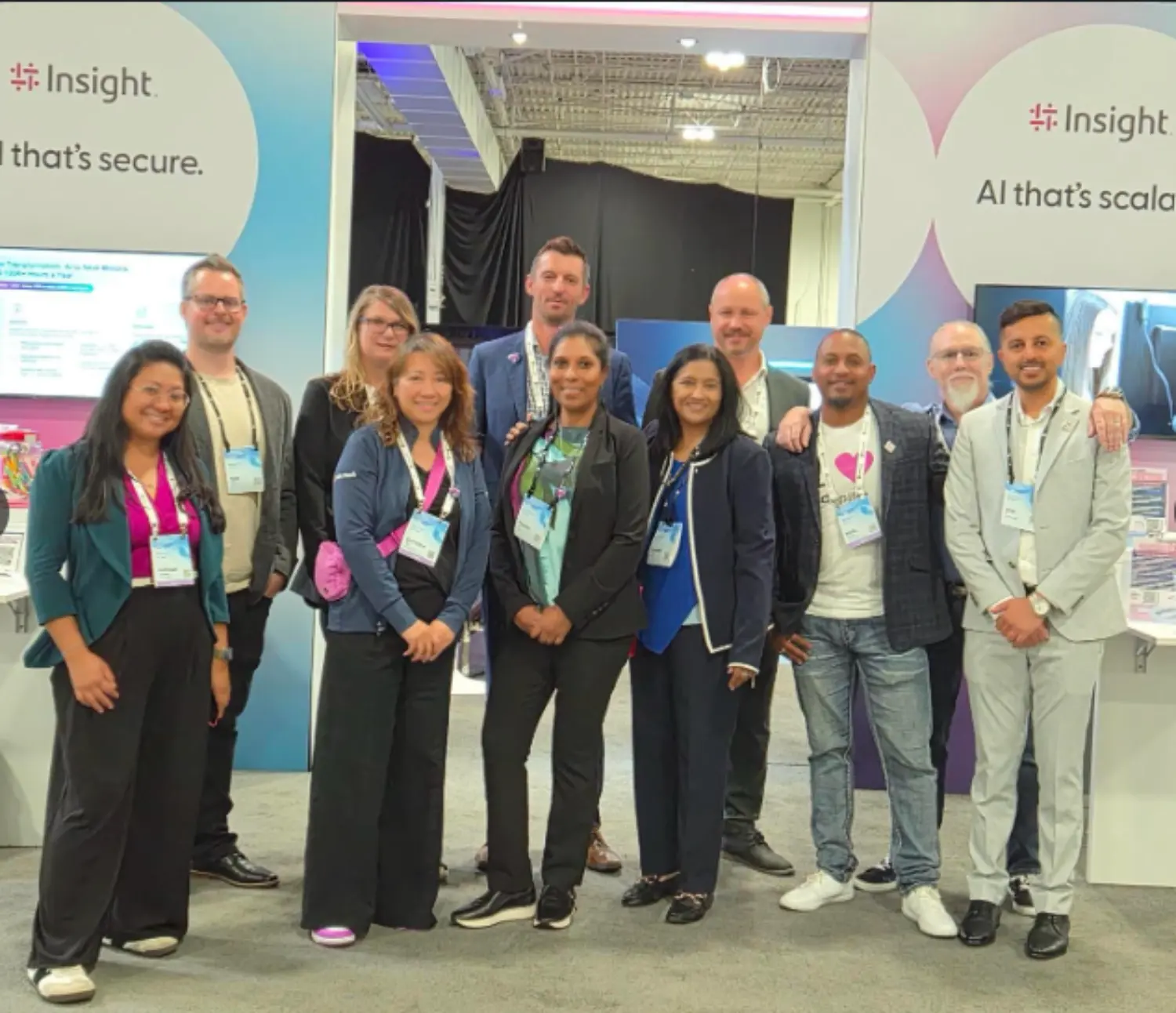 Teammates representing Insight at the AI Tour.