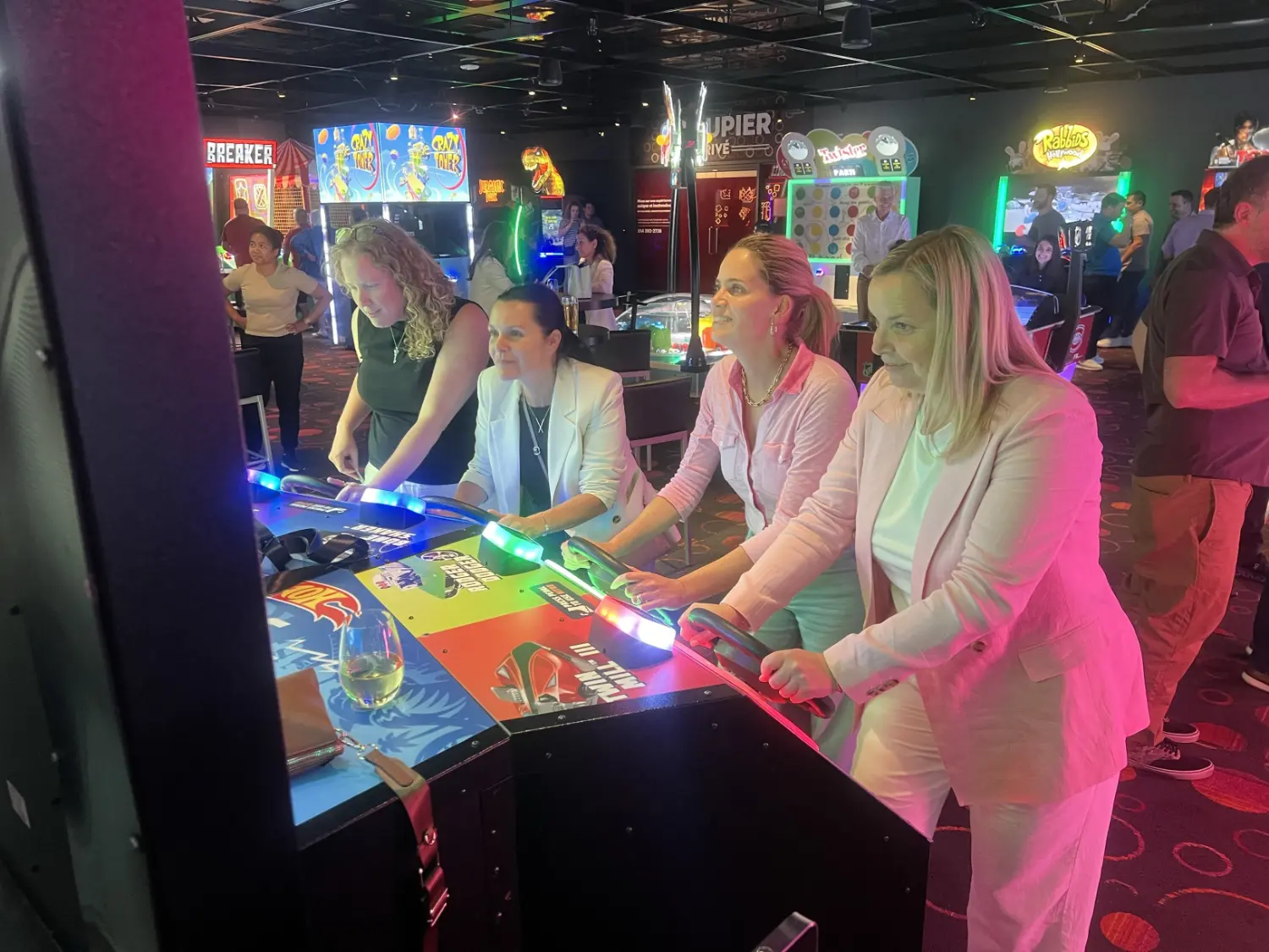 Playing arcades at casino with sales team