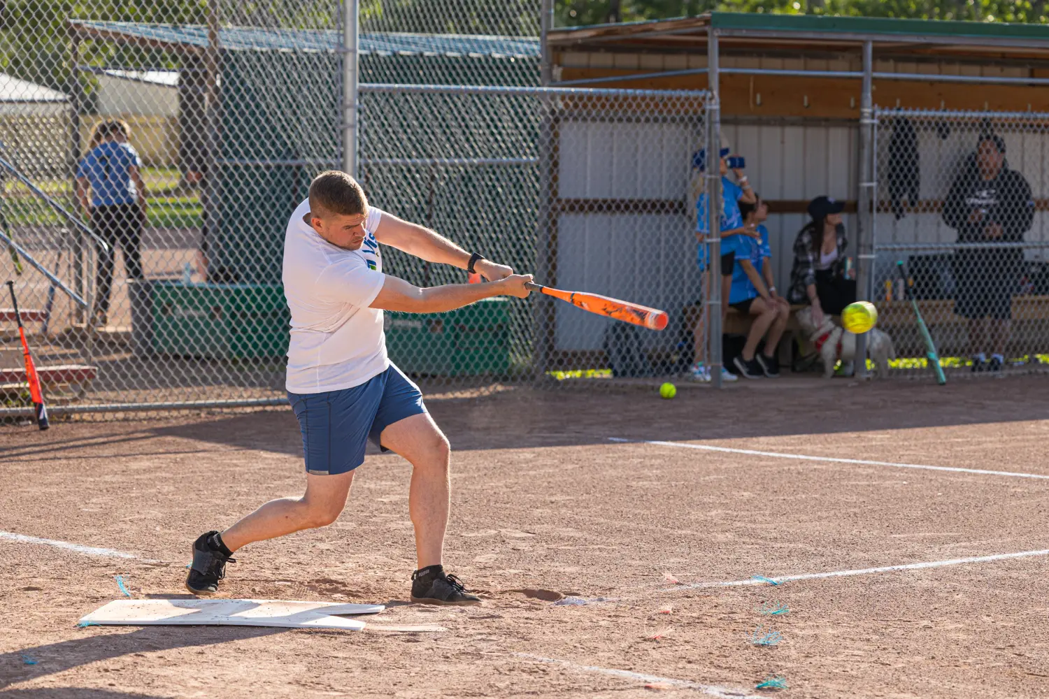 A member of the Vista Projects softball team swings for the fences during a recreational league game.