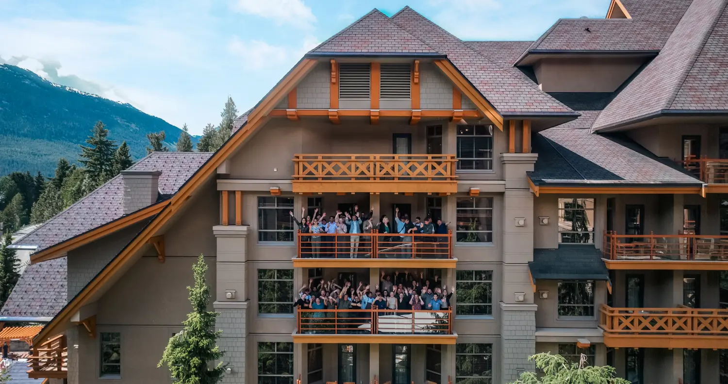 A drone shot taken from the balcony featuring our team gathered to celebrate the resort’s 20th anniversary in 2024