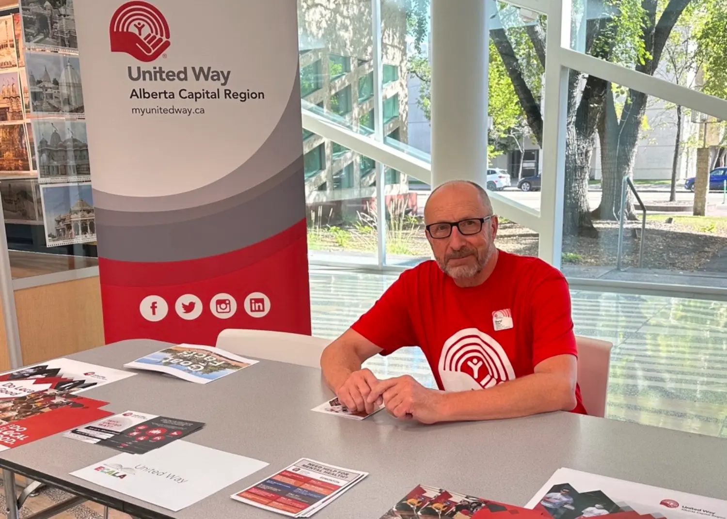 Sharing resources & smiles our team proudly connecting with the community at a local event.