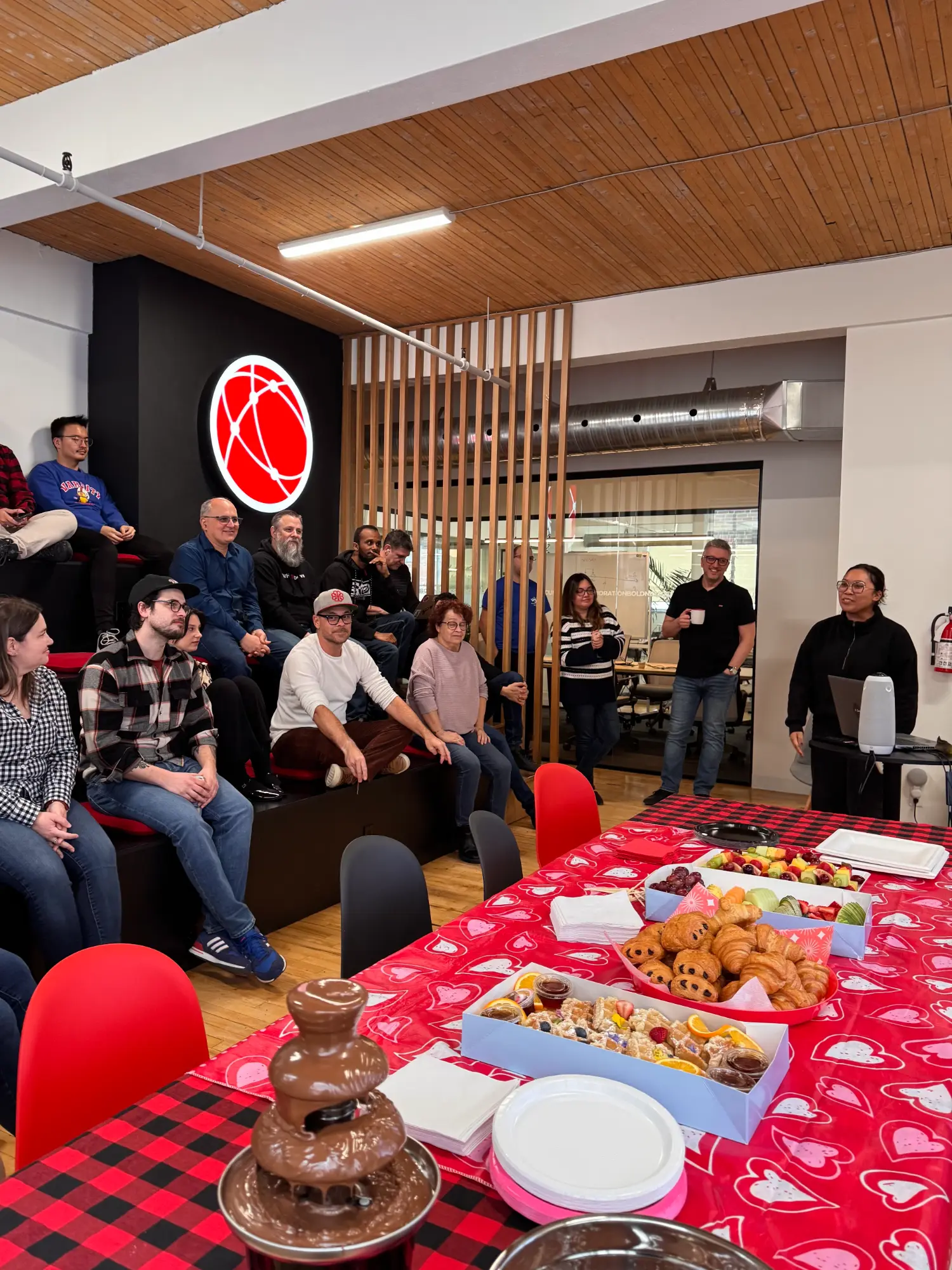 WHC team coming together in the office to celebrate monthly milestones and shared successes.