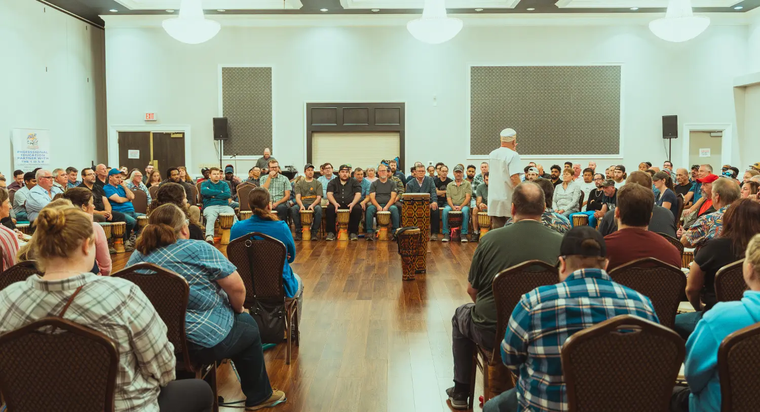 Our 20th anniversary celebrations included a fun-filled drum circle activity designed to highlight teamwork.