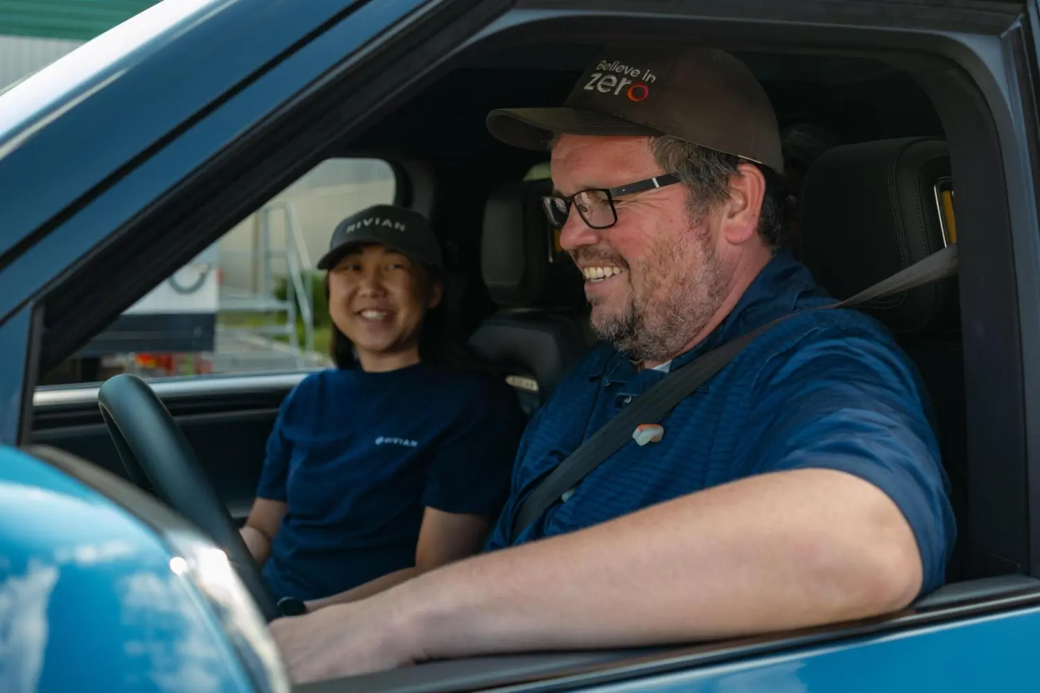 Employees getting an opportunity to test drive a vehicle with our parts at a customer event