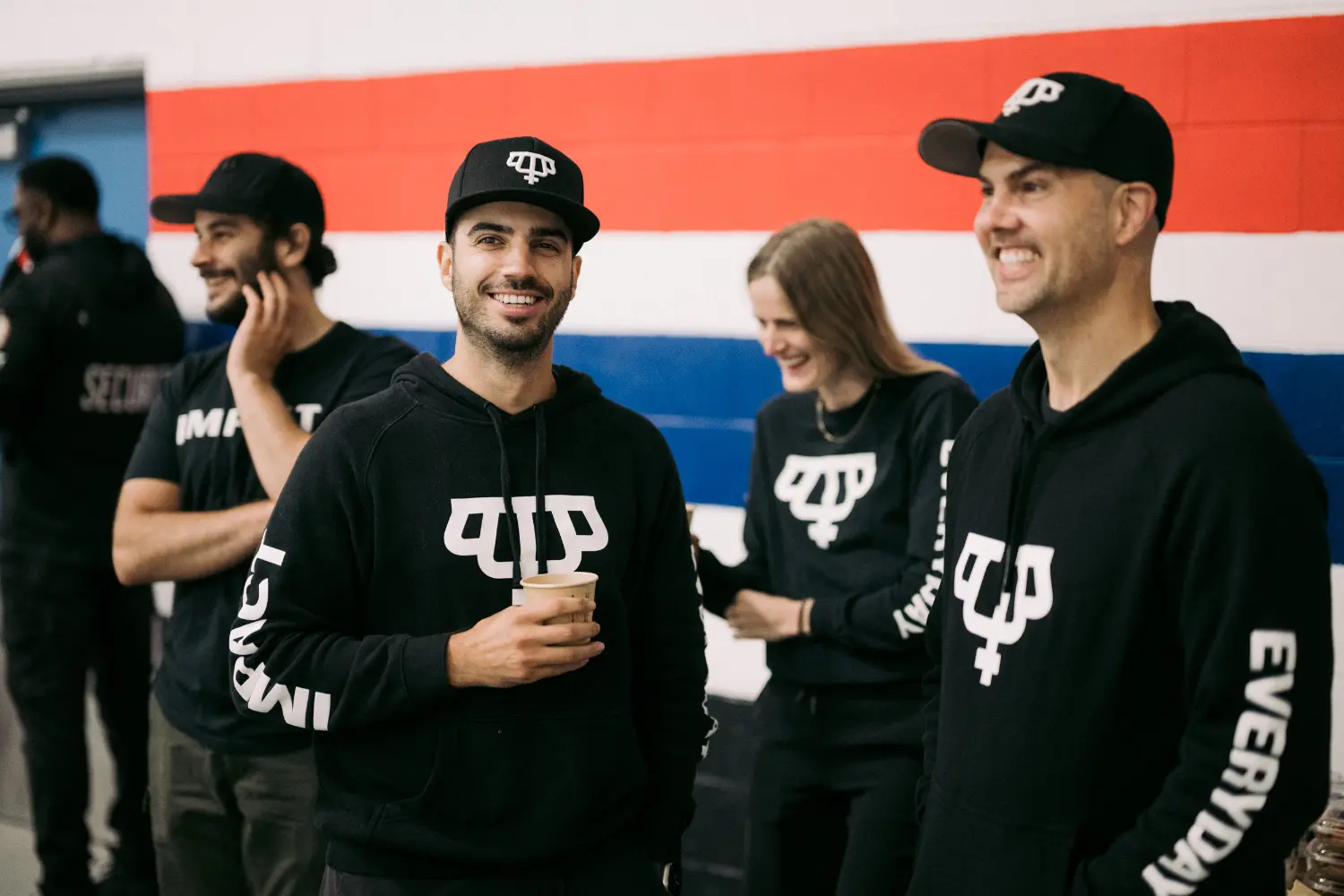 Happy employees on the sidelines of a hockey event
