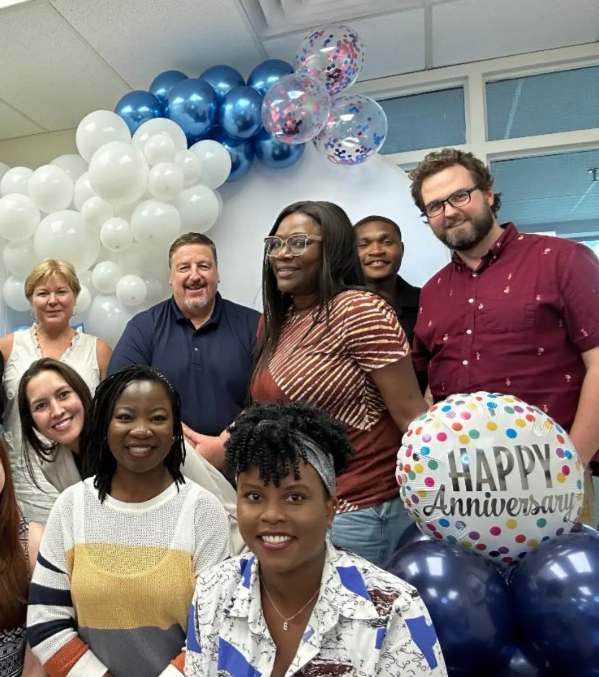 THRC team members celebrating staff anniversaries and shared milestones together.