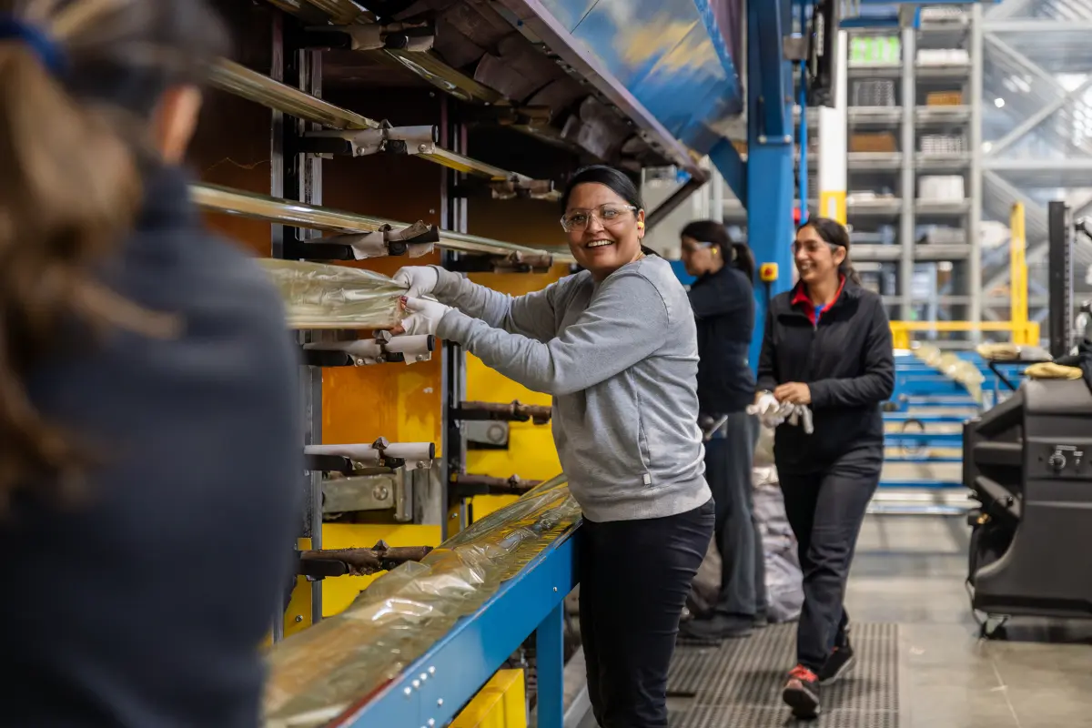 Manjinder works with her team on the finishing oven.