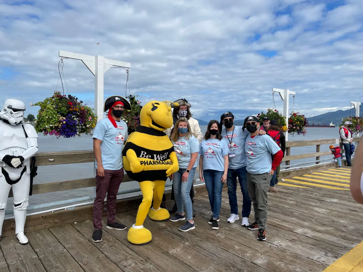 Our Team and Pharmasave Mascot Beatrice volunteering at the Boats for Hope Fundraiser