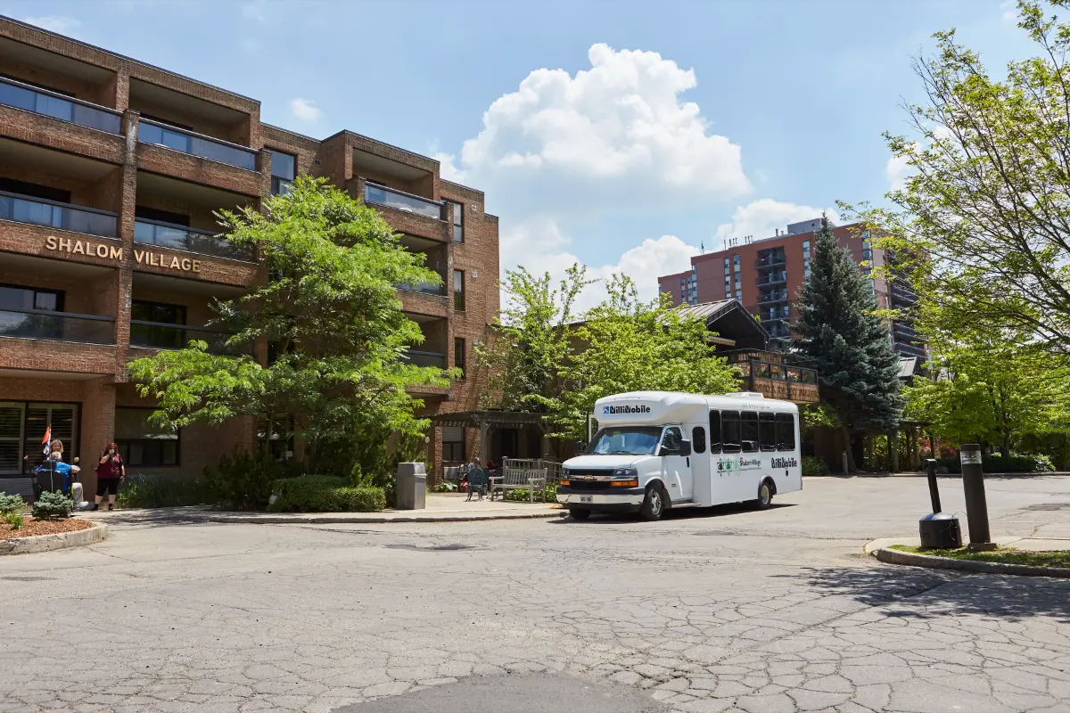 Our Milliemobile parked in front our Resident Apartments. The Milliemobile takes our residents out on day trips.