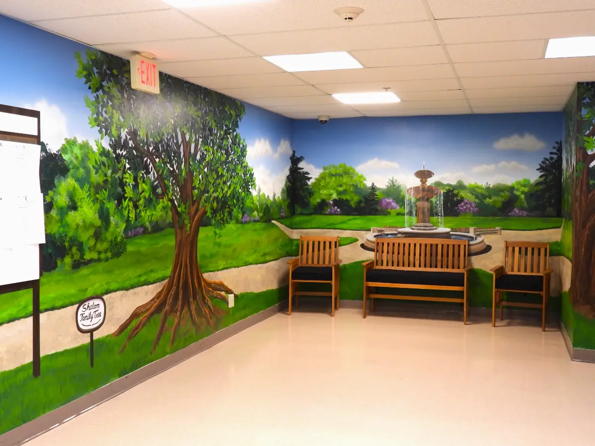 An indoor spot for residents and families. The painted murals was a 50th anniversary project for Shalom.