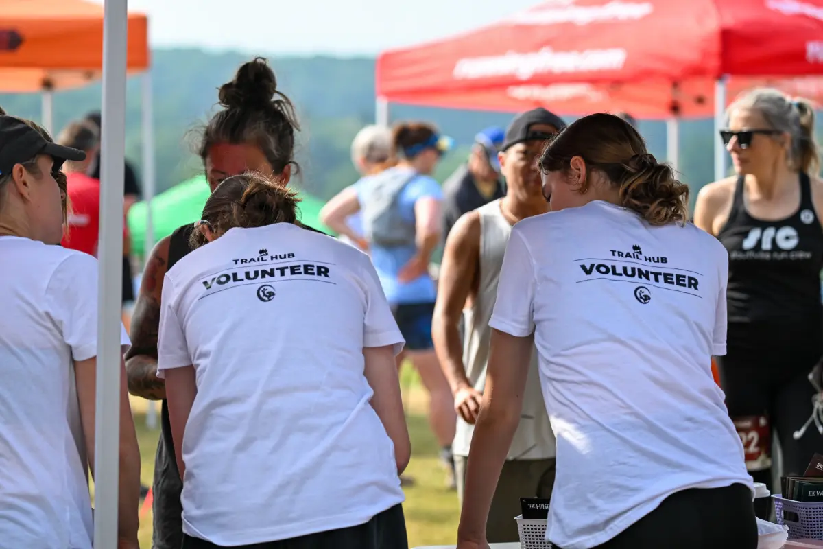Team members & community volunteers working together to maintain and protect the forest systems that define our purpose
