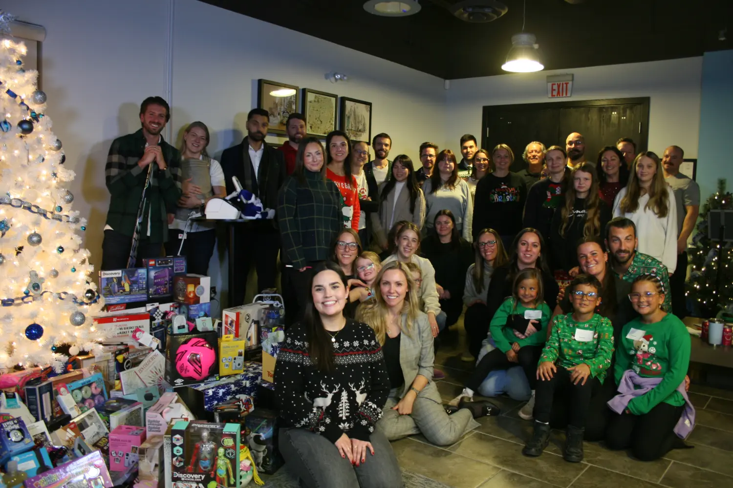 Our team and their families gather for the annual wrap-a-thon getting things ready to drop off to the Salvation Army