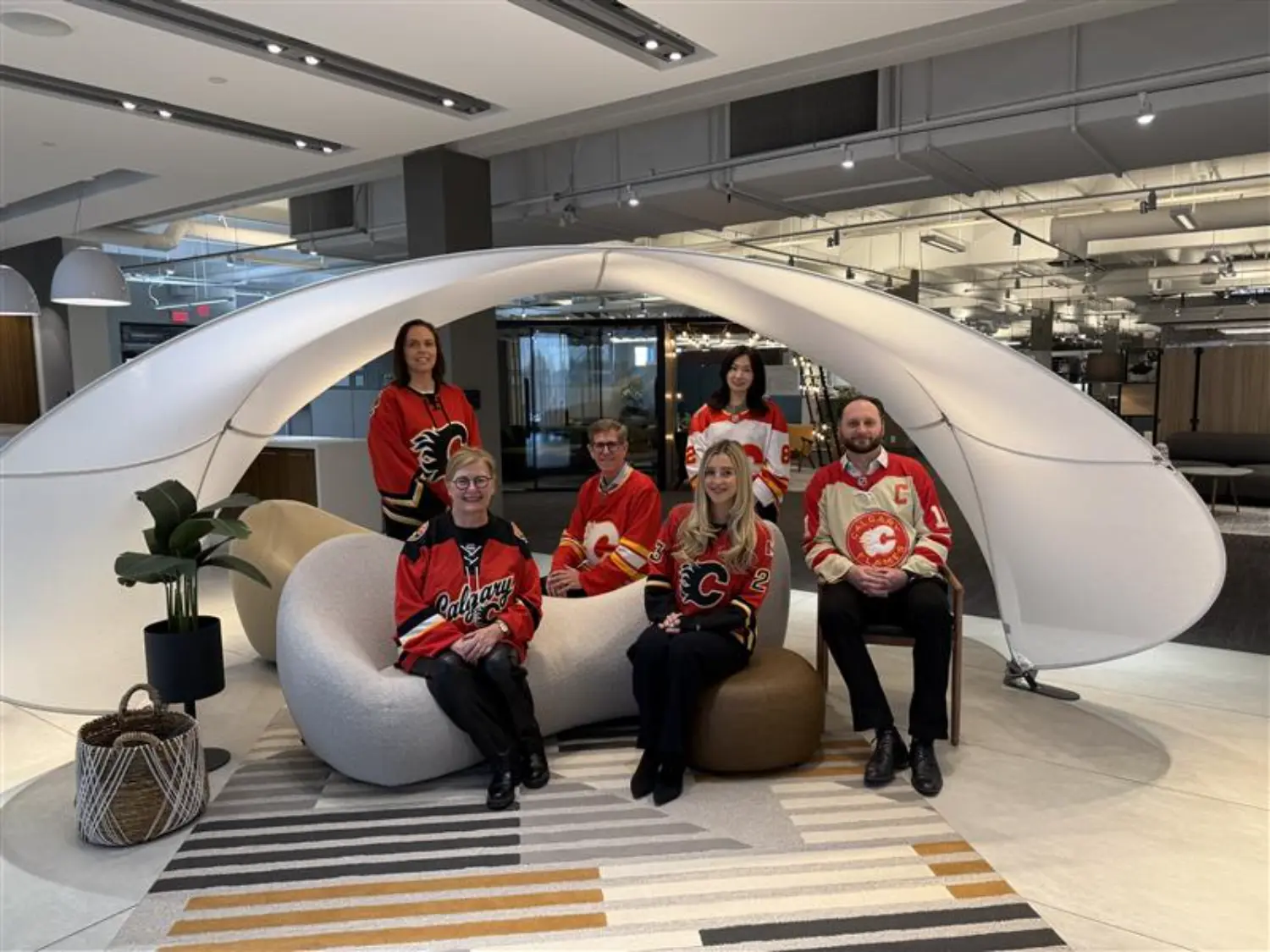 RGO team shows their spirit in Flames jerseys, supporting each other and our Calgary community.
