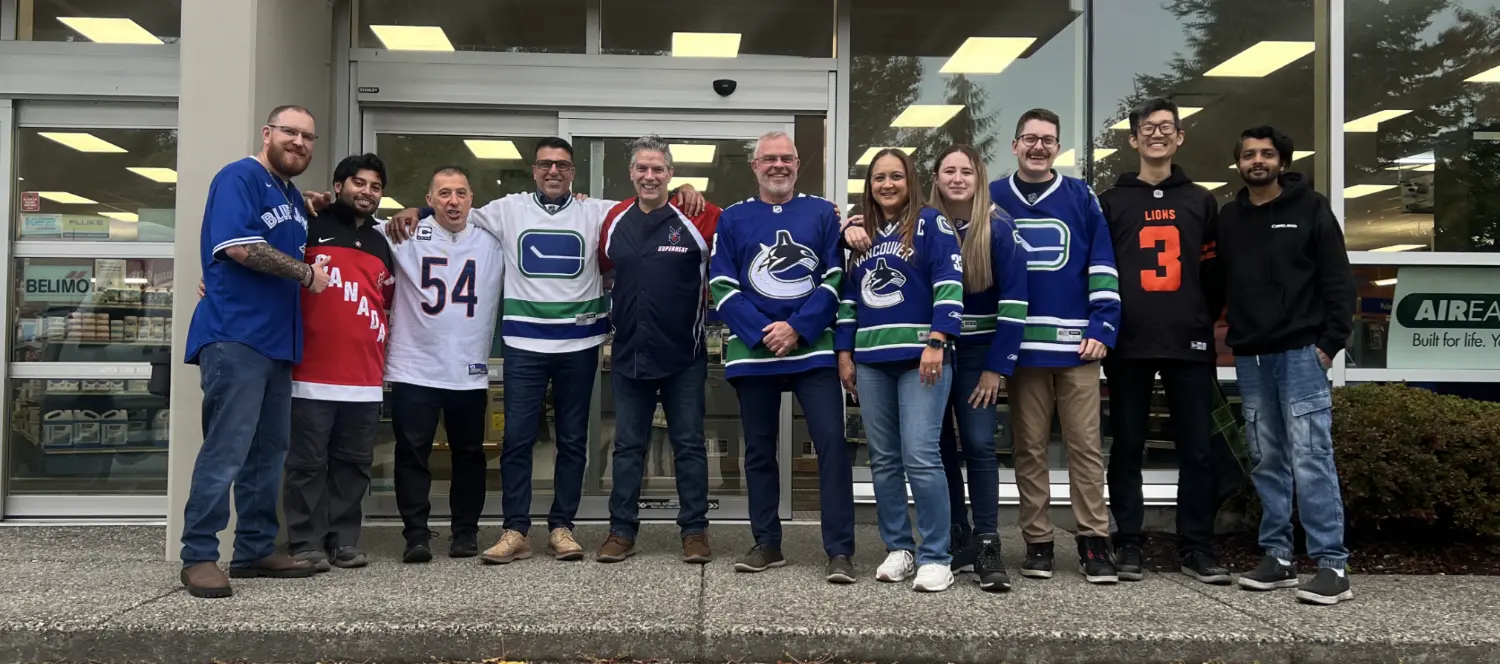 Our team at the South Burnaby Branch like to have fun on Fridays and wear their favorite team's jersey.