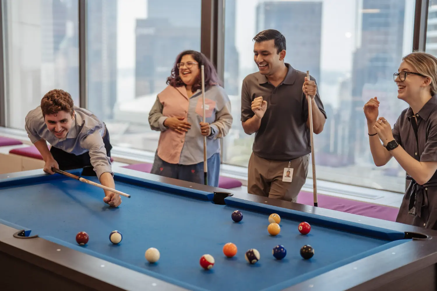 Employees playing pool