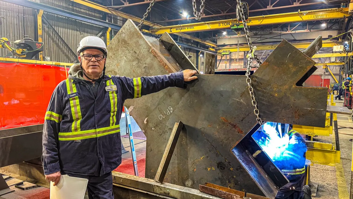 Duarte Machado in front of a special steel connection piece of structural steel.