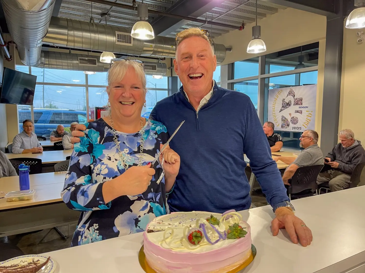 Barb Barron, Office manager and Steve Benson CEO and President celebrating Barb's anniversary as an employee.