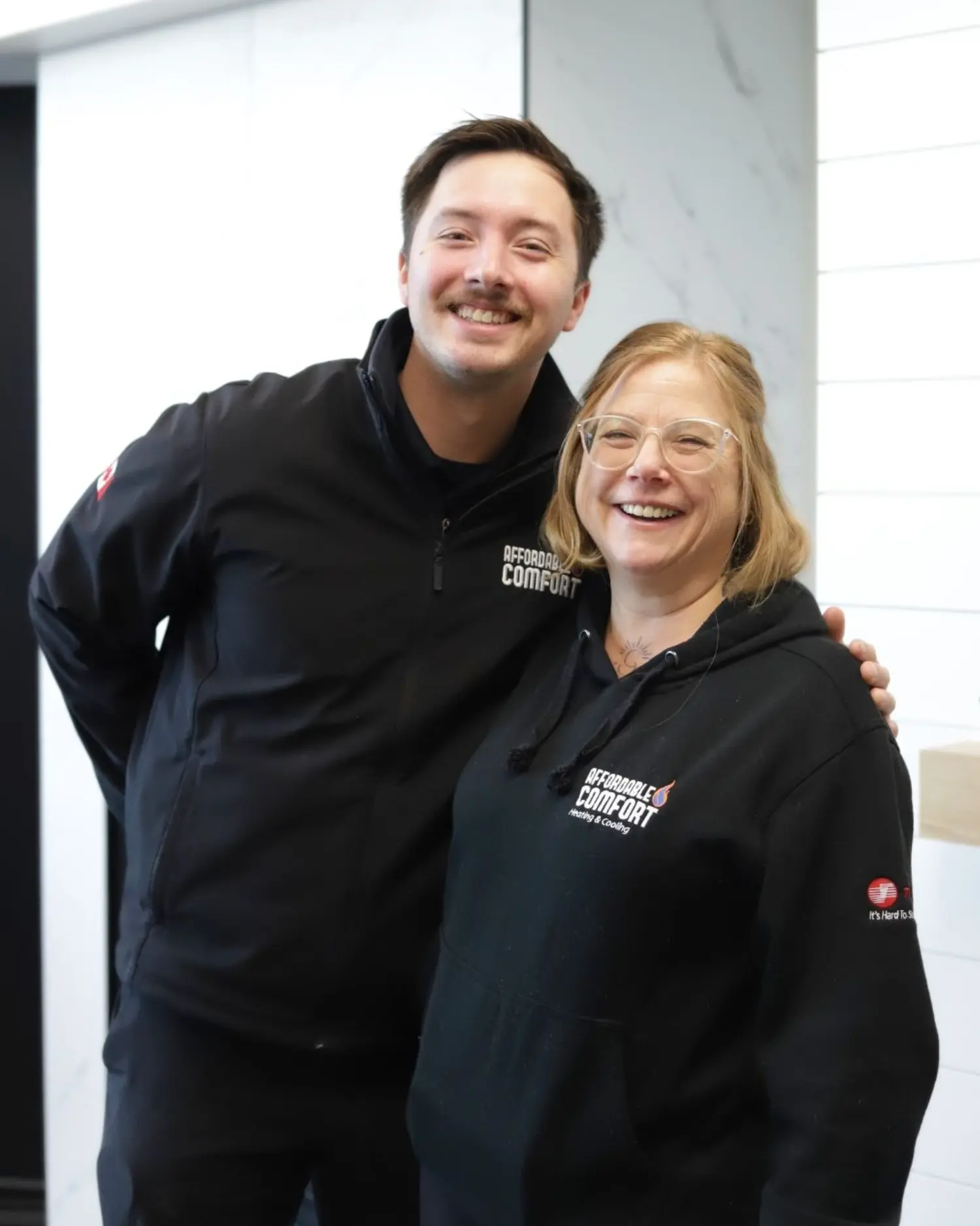 Employees enjoying teamwork and camaraderie at Affordable Comfort.