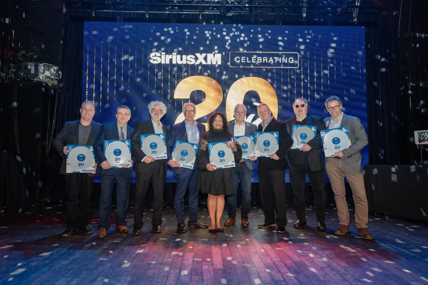 Celebrating our 20th anniversary at the Opera House - honoring 20-year employees with a Platinum Album plaque.