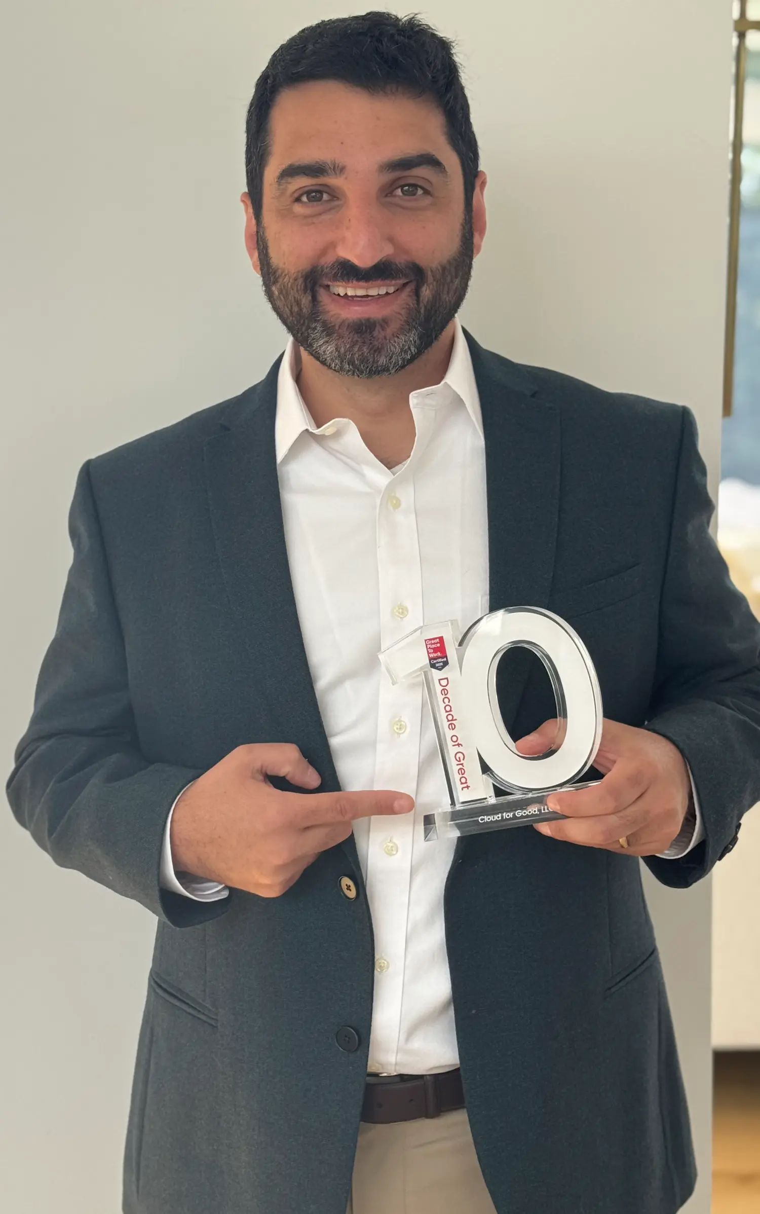 CEO Tal Frankfurt with Great Place to Work, Decade of Great Award.