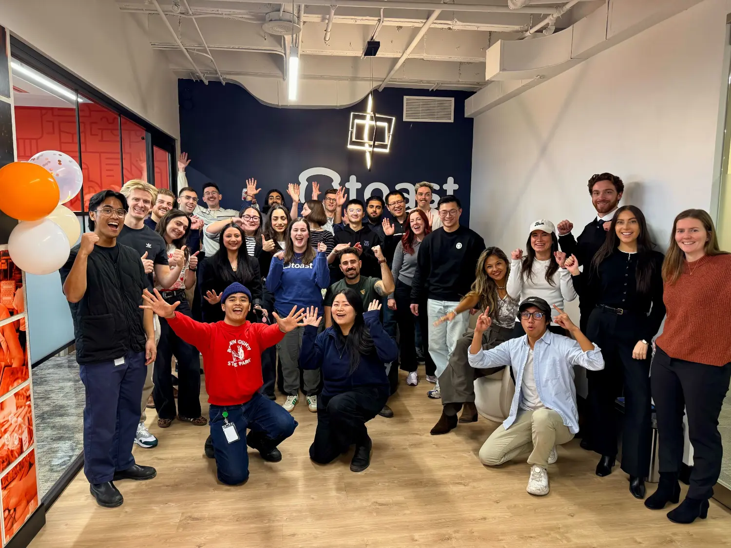 Our Canada team gathering at the new Toronto office to celebrate a culture of community and shared success.