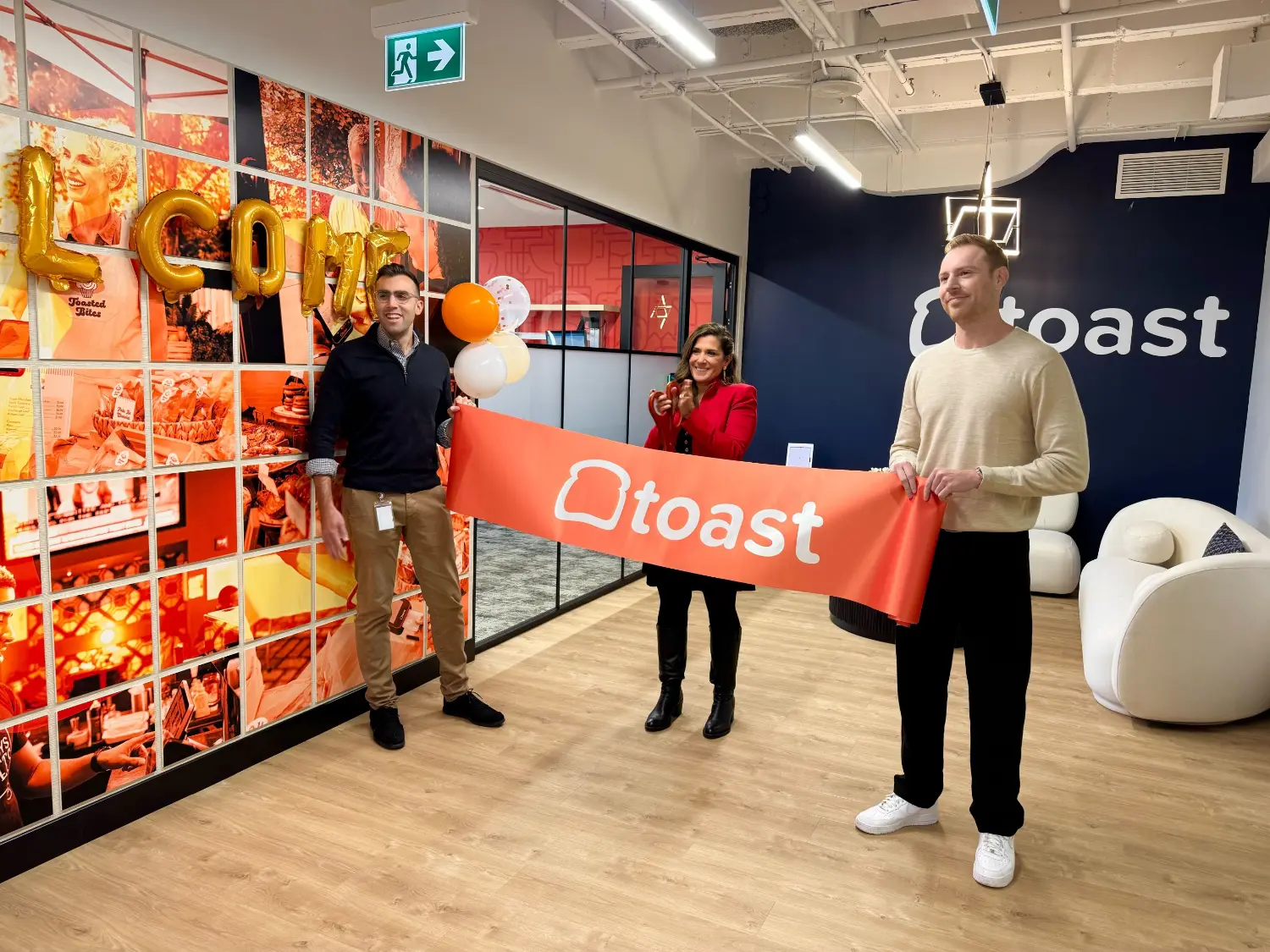 Leadership and team members celebrating the grand opening of our modern Canada office location in Toronto.